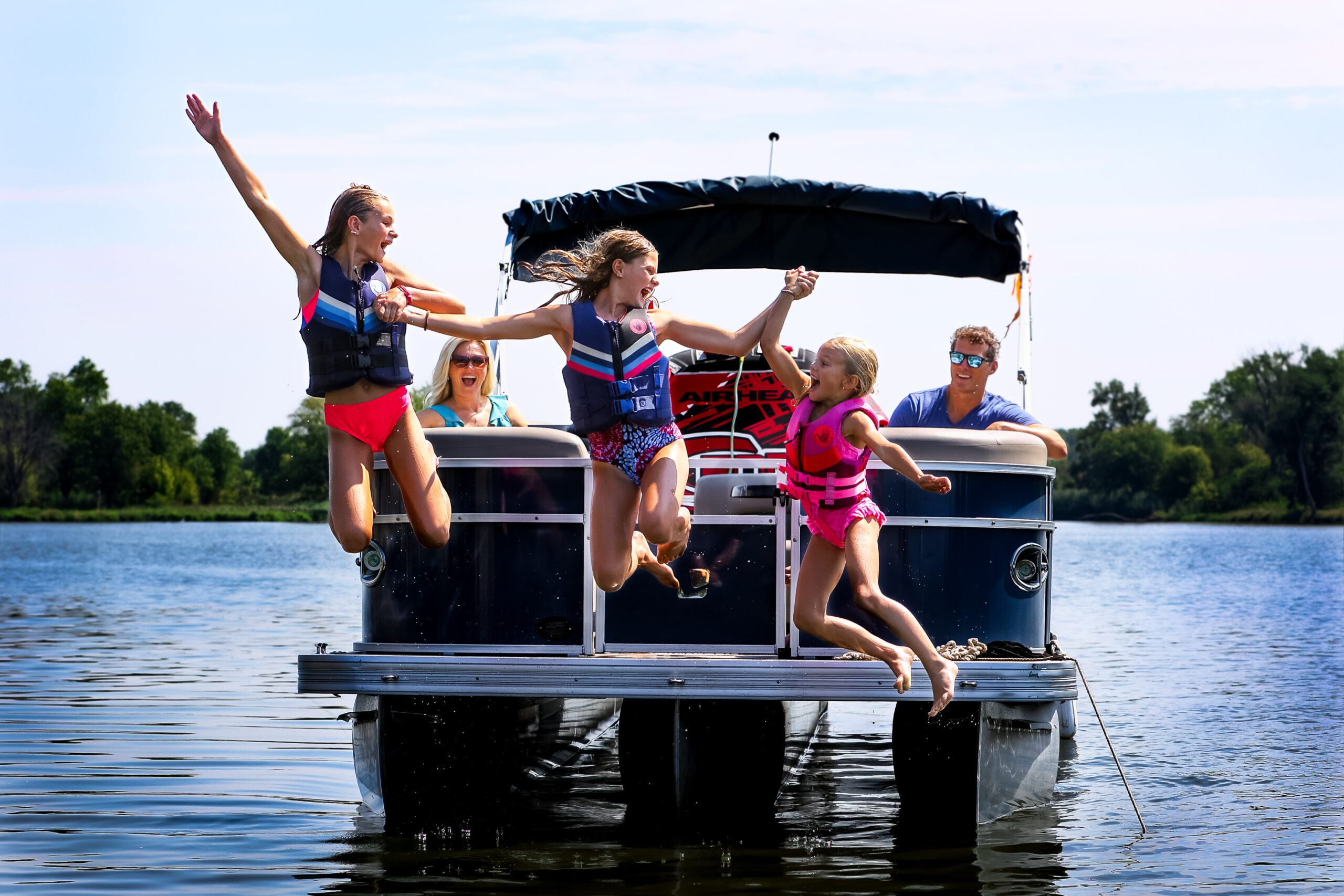 Family enjoying Quest Express Boat Club Ottawa IL from a pontoon boat